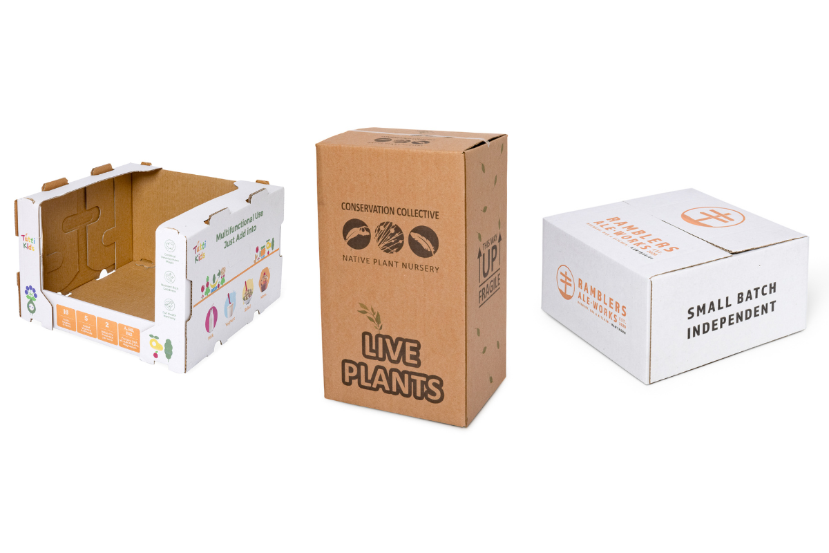 white and brown cardboard boxes with printed designs